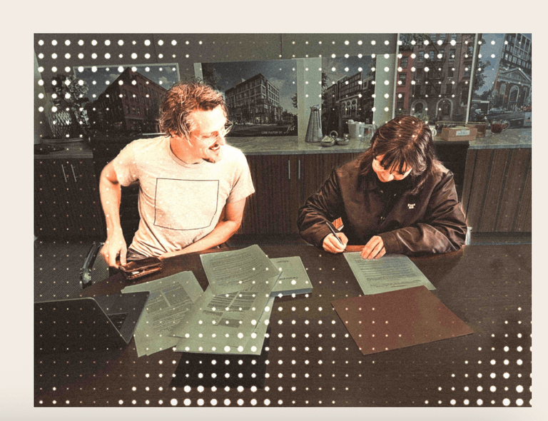 Founders signing the first store lease paperwork at closing